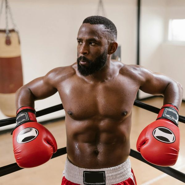 Close-up on a man's focused expression during a workout.