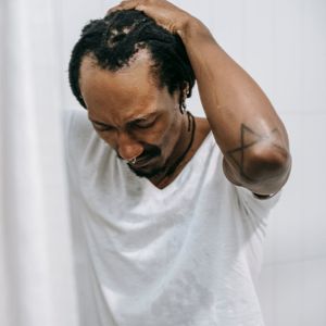 Man holding a difficult balance pose.